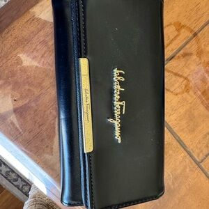 Salvatore Ferragamo Black Leather Clutch with Gold Accents